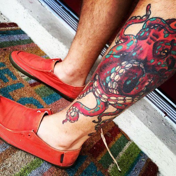 Red Octopus Tattoo On Lower Leg