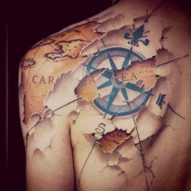 Ripped Skin Compass Nautical Tattoo On back
