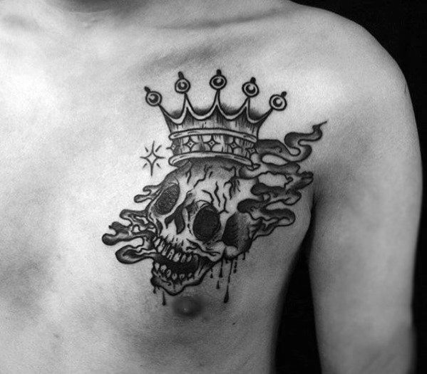 Scary Skull With Crown Tattoo On Chest