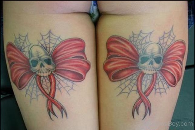 Skull And Bow Tattoo On Thigh