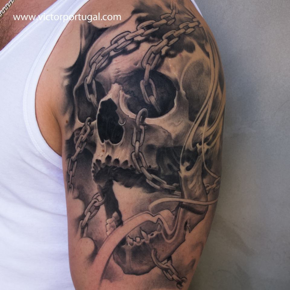 Skull With Chain Tattoo On Bicep