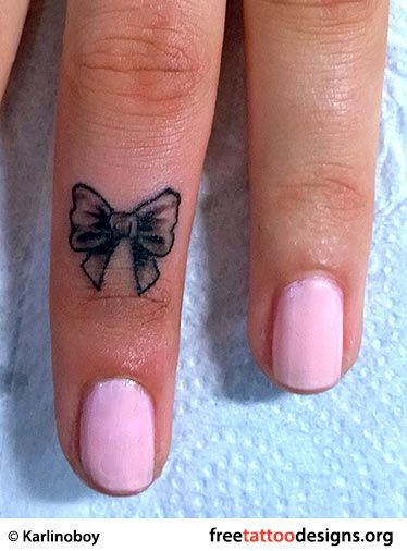 Small Bow Tattoo On Finger