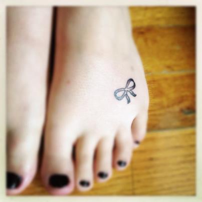 Small Bow Tattoo On Foot