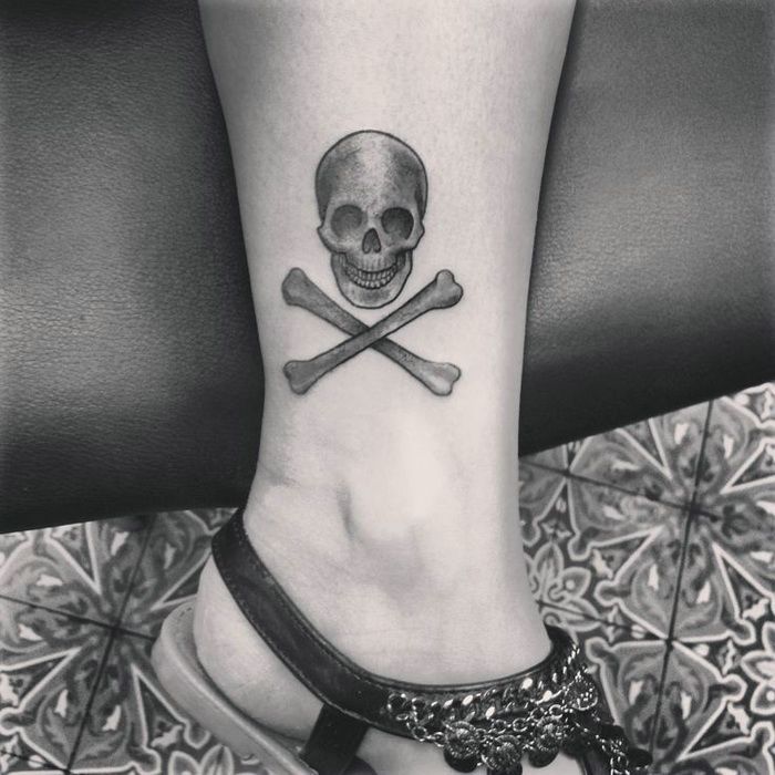 Small Danger Skull Tattoo On Leg
