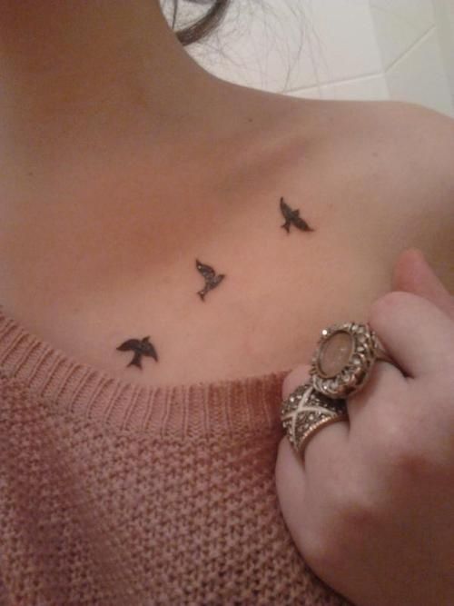 Small Flying Birds Tattoo On Upper Chest Of Woman