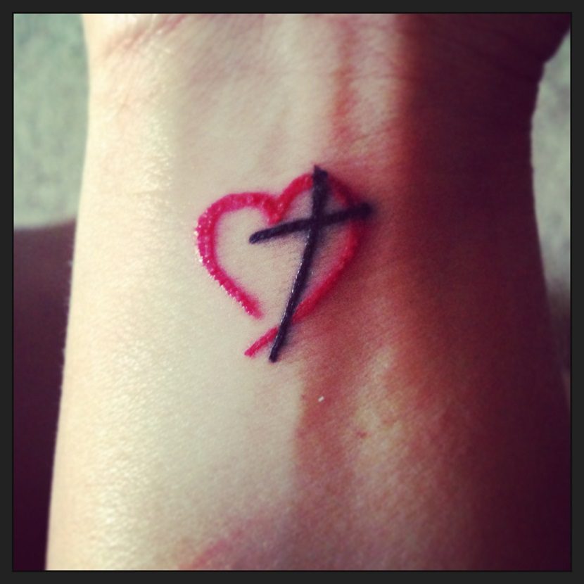 Small Red Heart And black Cross Tattoo On Wrist