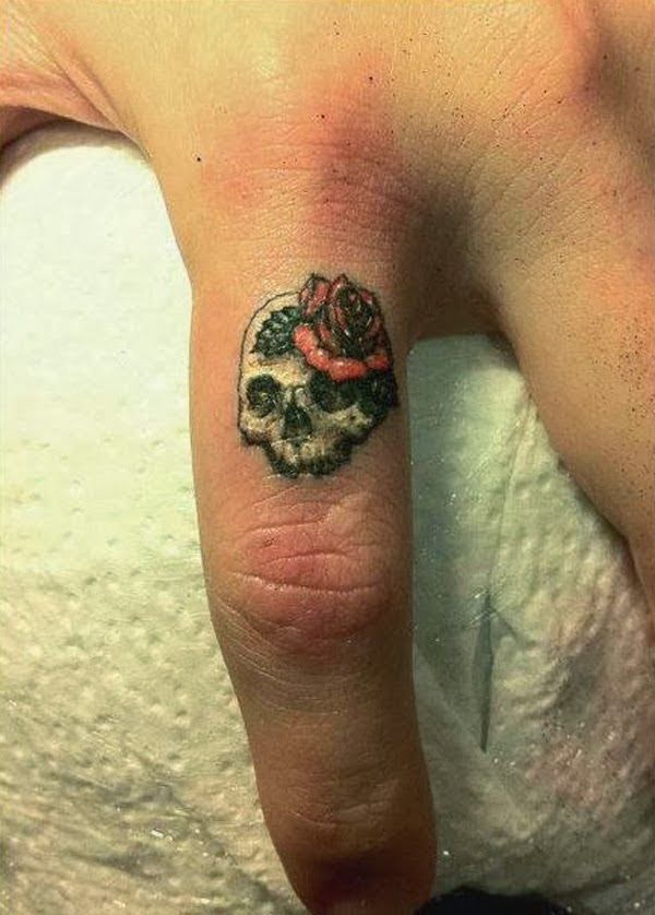 Small Skull With Rose flower tattoo On Finger