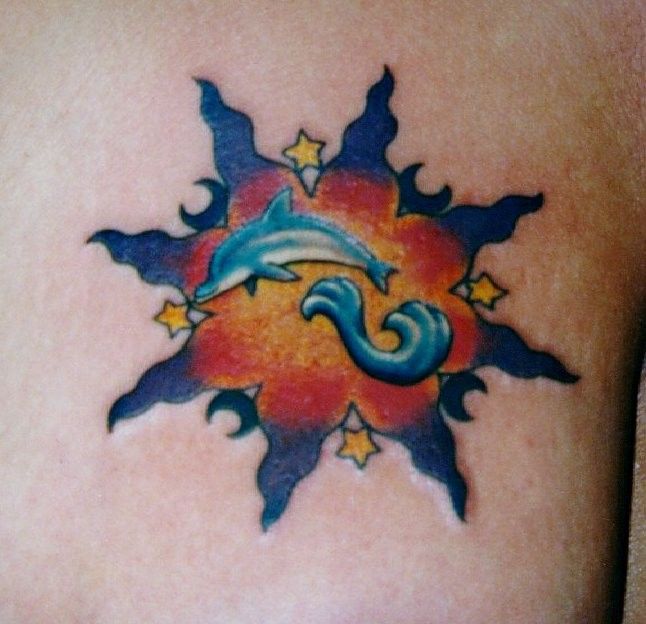 Sun With Stars And Dolphin Tattoo Design
