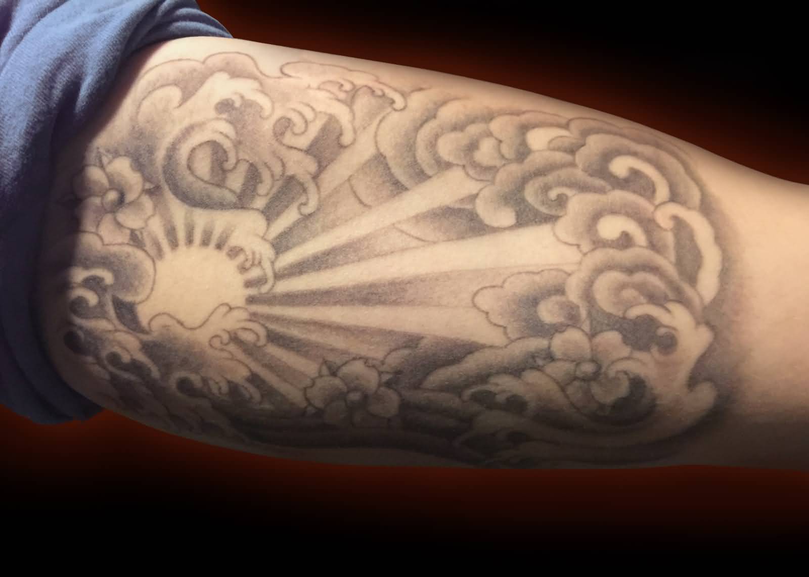 Sun behind Cloud Tattoo On Forearm