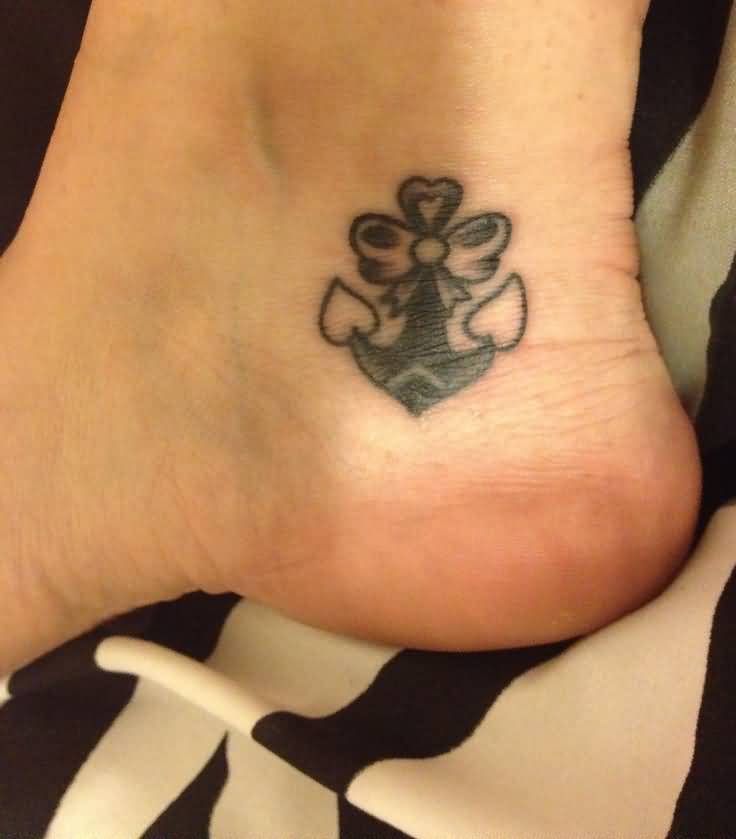 Tiny Anchor And Bow Tattoo On ankle
