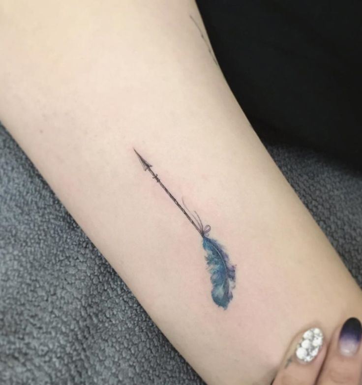 Tiny Arrow And Feather Tattoo On Arm
