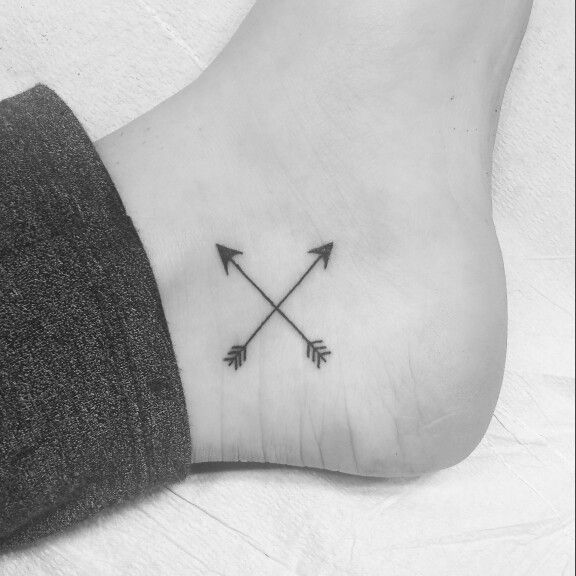 Tiny Cross Arrows Tattoo On Foot