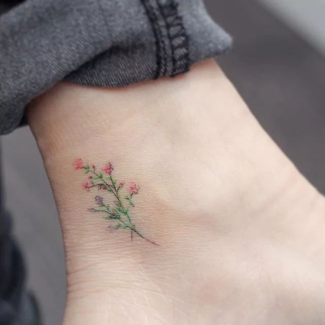 Tiny Watercolor Flower Tattoo On Ankle