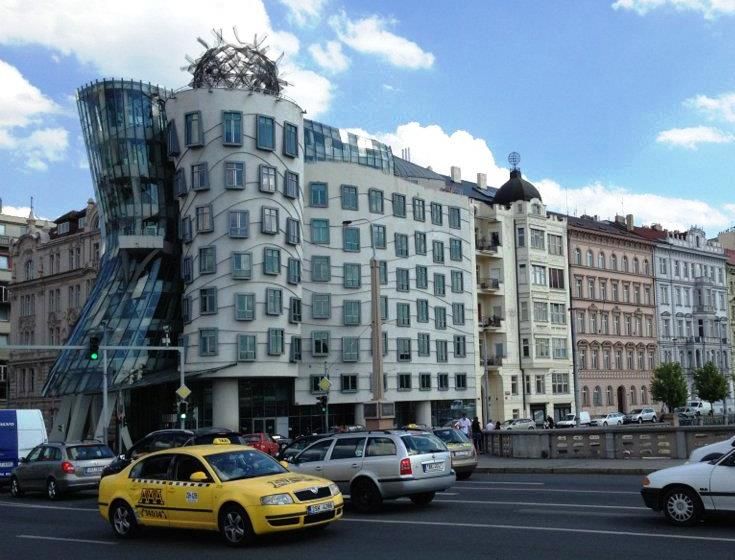 Traffic Passing In Front Of The Dancing House
