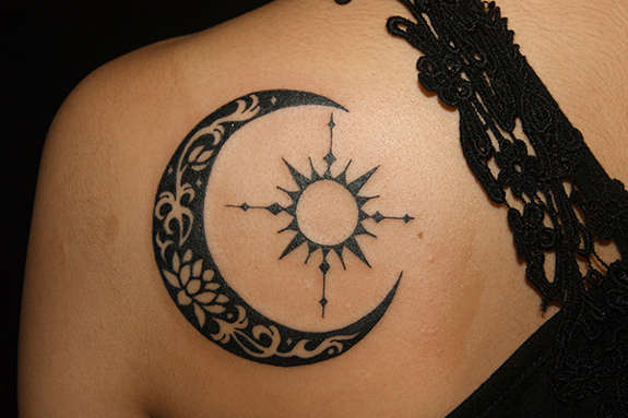 Tribal Mon And Sun Tattoo On Girl back Shoulder