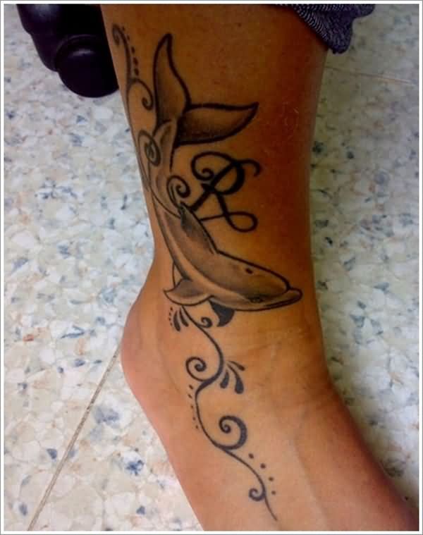 Tribal Vine And Dolphin Tattoo On Leg