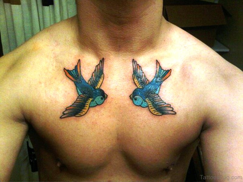 Two Blue Flying Birds Tattoo On Chest