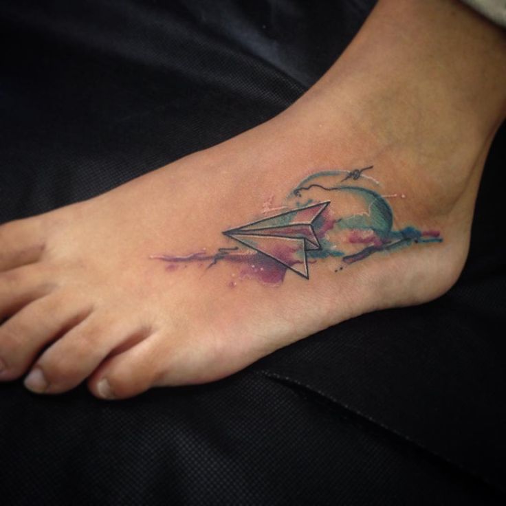 Watercolor Paper Plane tattoo On Foot