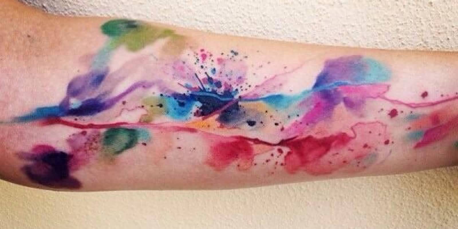Watercolor Splash Tattoo On Forearm
