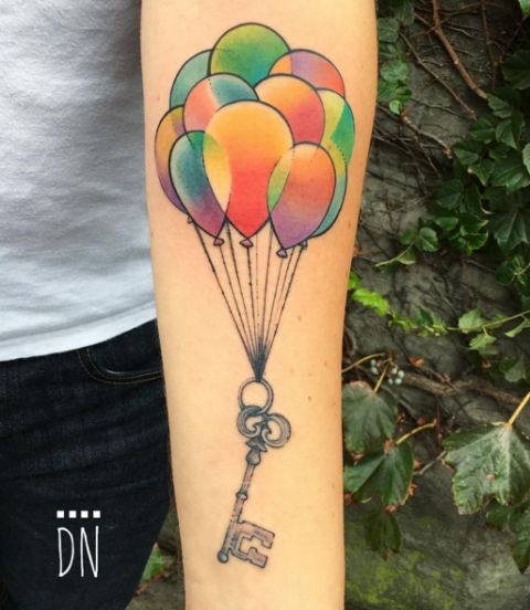 Watercolor Treasure Key And Balloons Tattoo On forearm