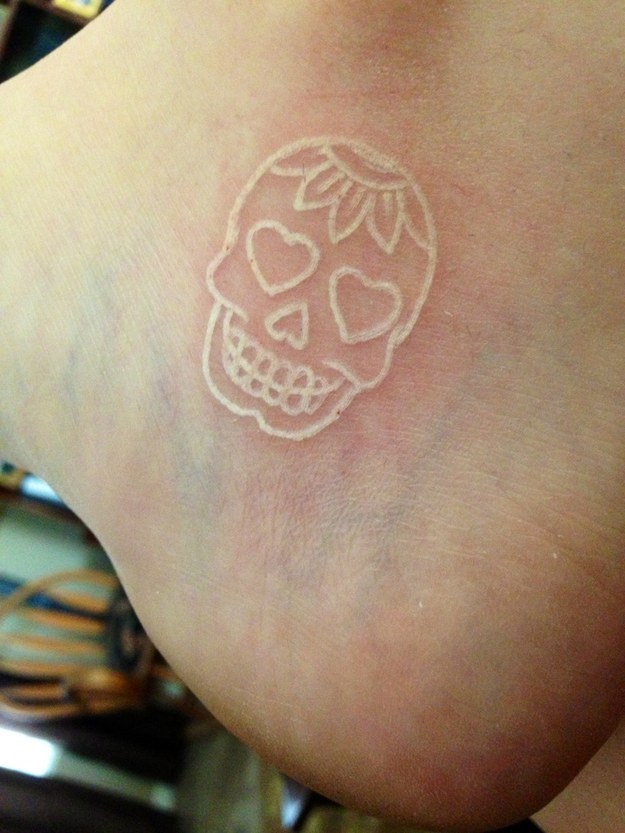 White ink Skull Tattoo On Foot