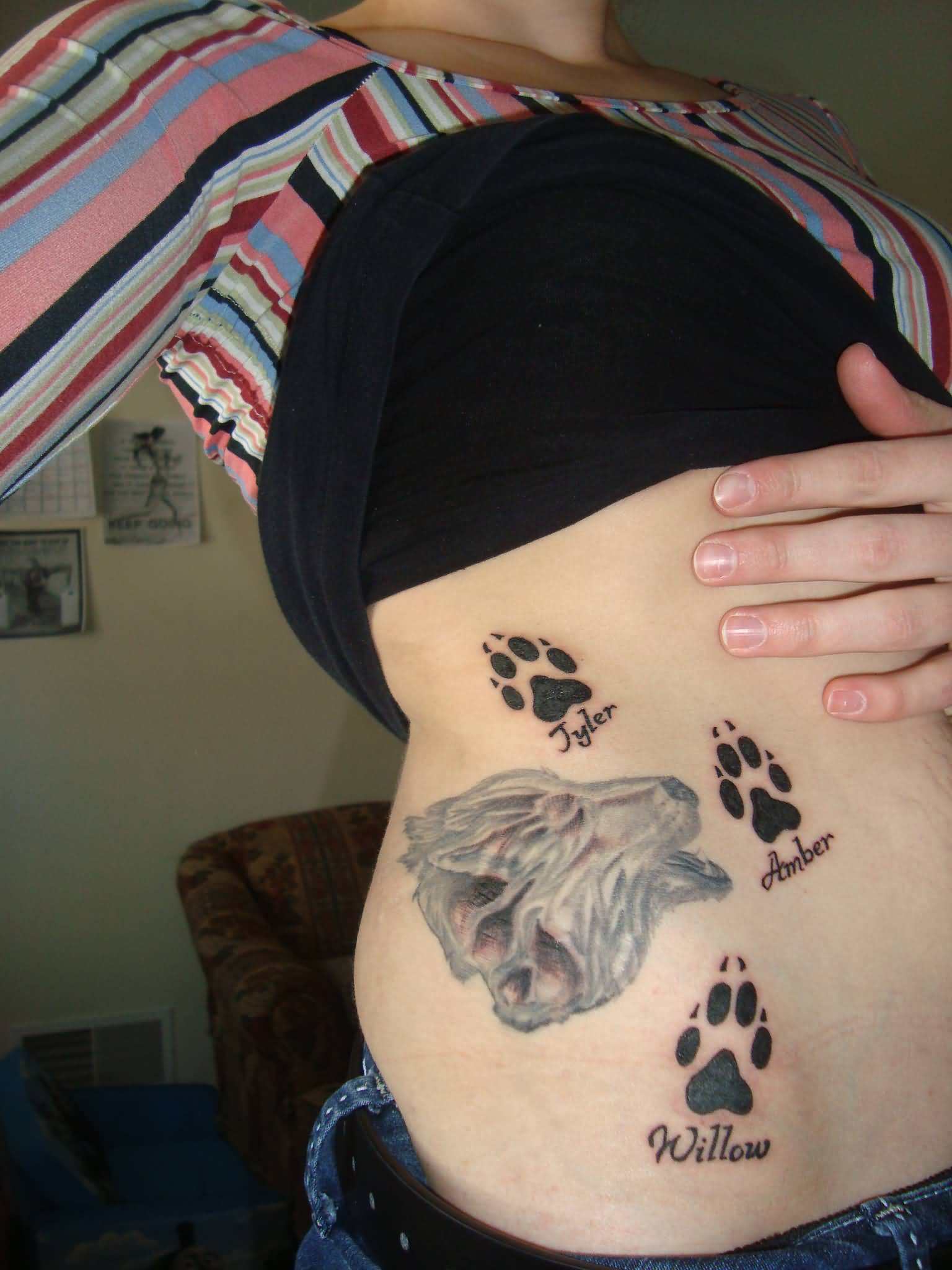 Wolf Paw Prints Tattoo On Girls Side Rib