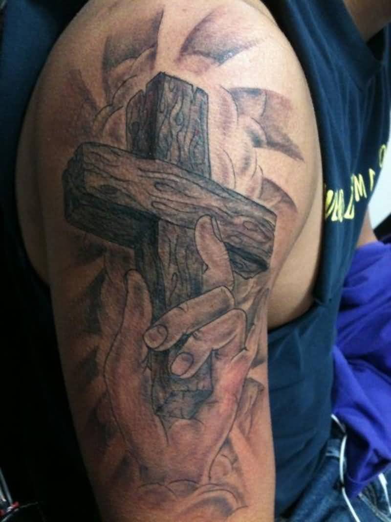 Wooden Cross In Hand Tattoo On Half Sleeve