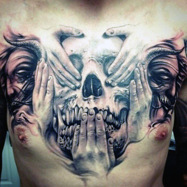 hands And Skull Tattoo On Chest