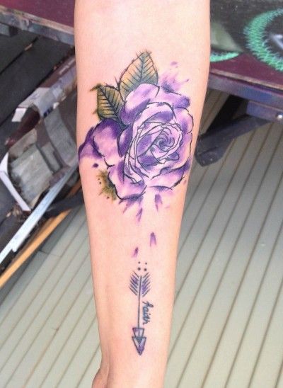 purple watercolor rose flower tattoo on forearm