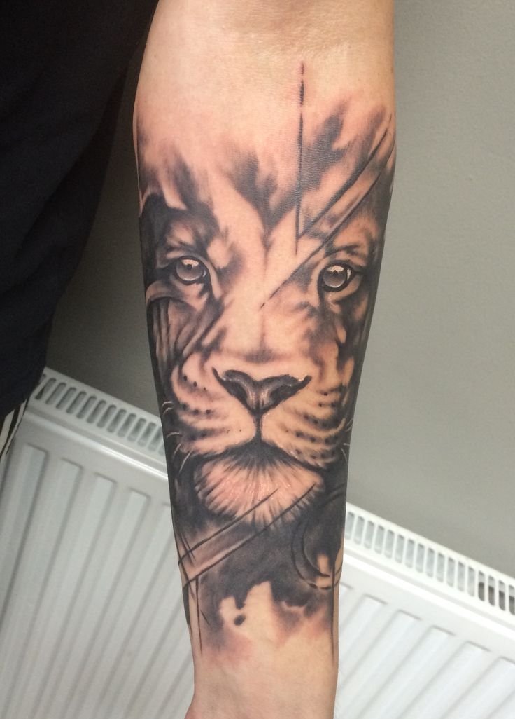 Abstract Lion Face Tattoo On Forearm