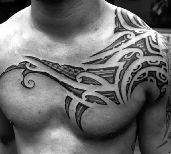Amazing Shaded Tribal Chest Tattoo For Men
