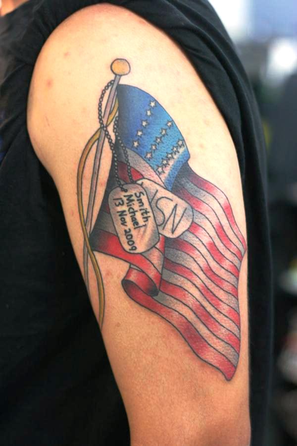 American Flag With Dog Tags Tattoo On upper Arm