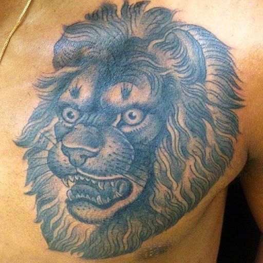 Angry Face Lion Tattoo On Chest For Men