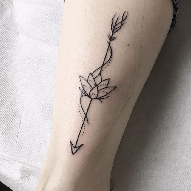 Arrow And Lotus Flower tattoo On Leg