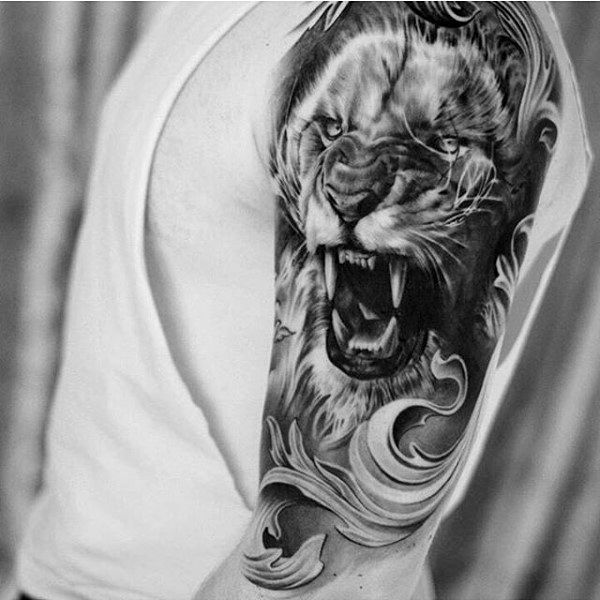 Black And gray Ferocious Lion Face Tattoo With Wave Design