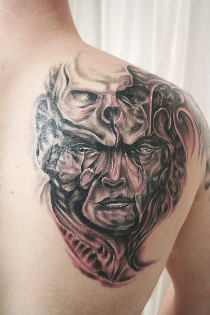 Black & Grey Mystical Demon With Skull Tattoo On Shoulder Blade