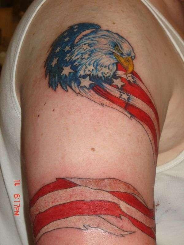 Eagle Face And American Flag Tattoo On Upper Arm
