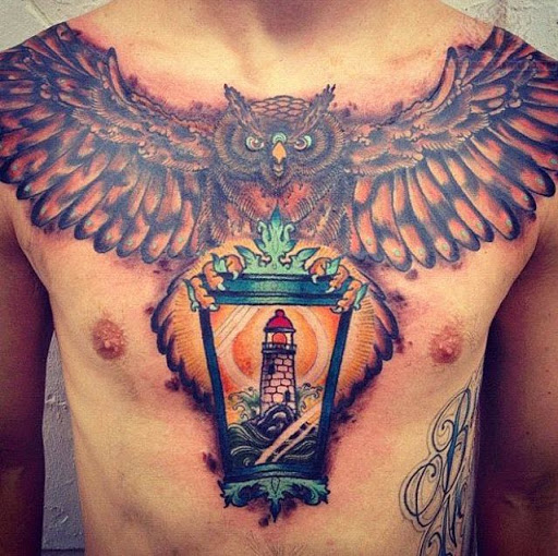 Flying Owl Holding a Portrait Chest Tattoo For Men