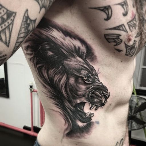 Gray Lion Tattoo On Side rib Cage