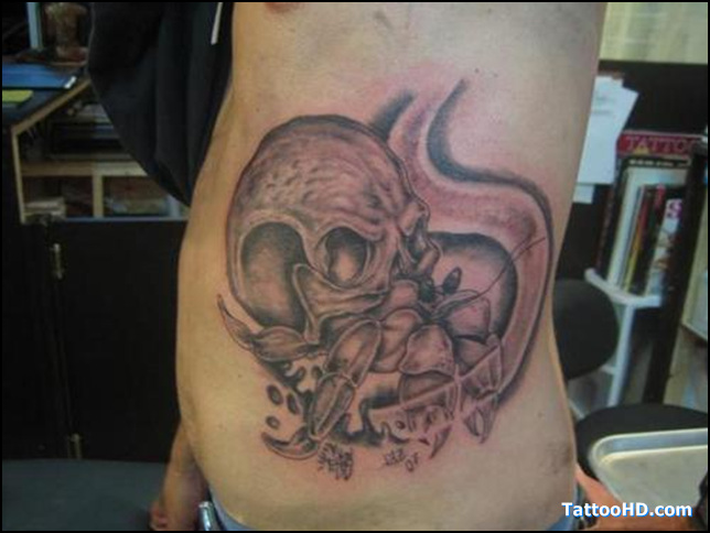 Gray Skull And Crab Tattoo On Side rib
