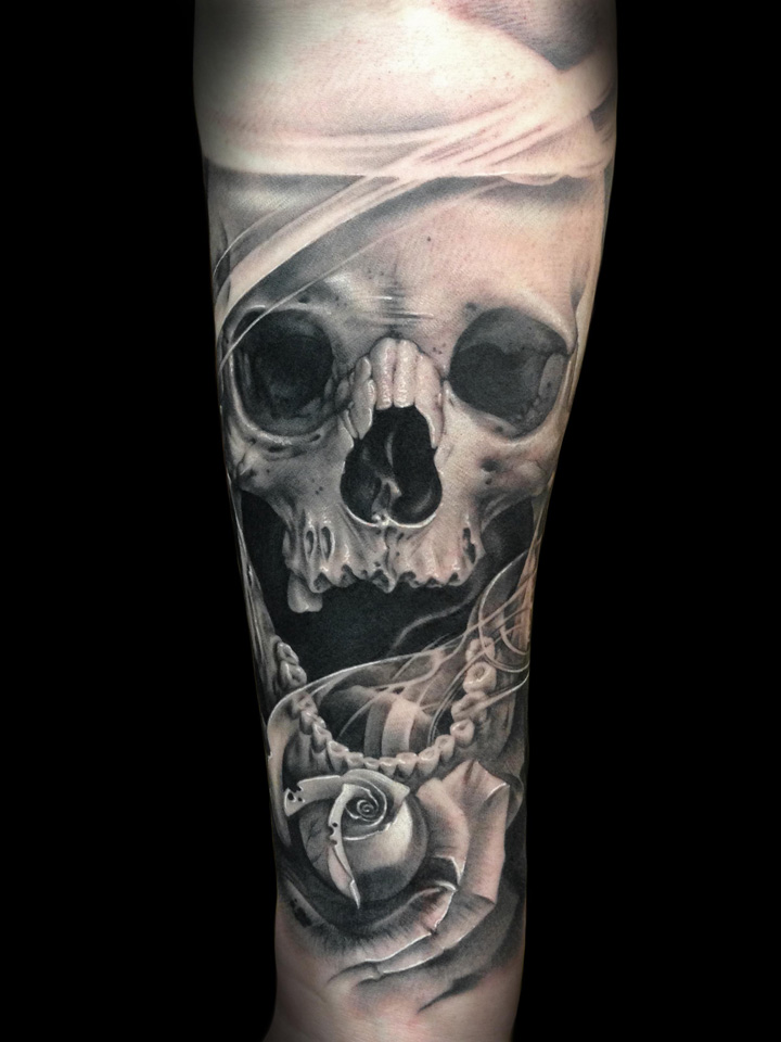Grey Ink Skull Demon Tattoo On Forearm