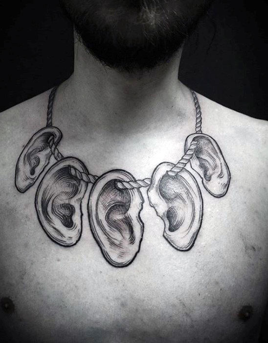 Human Ears On Rope Tattoo On Male Chest