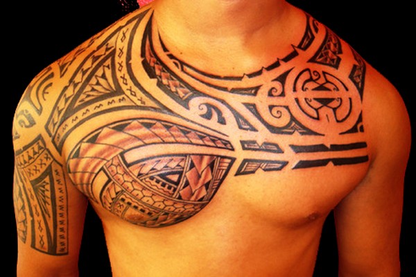 Impressive Hawaiian Tribal Chest and Arm Tattoo