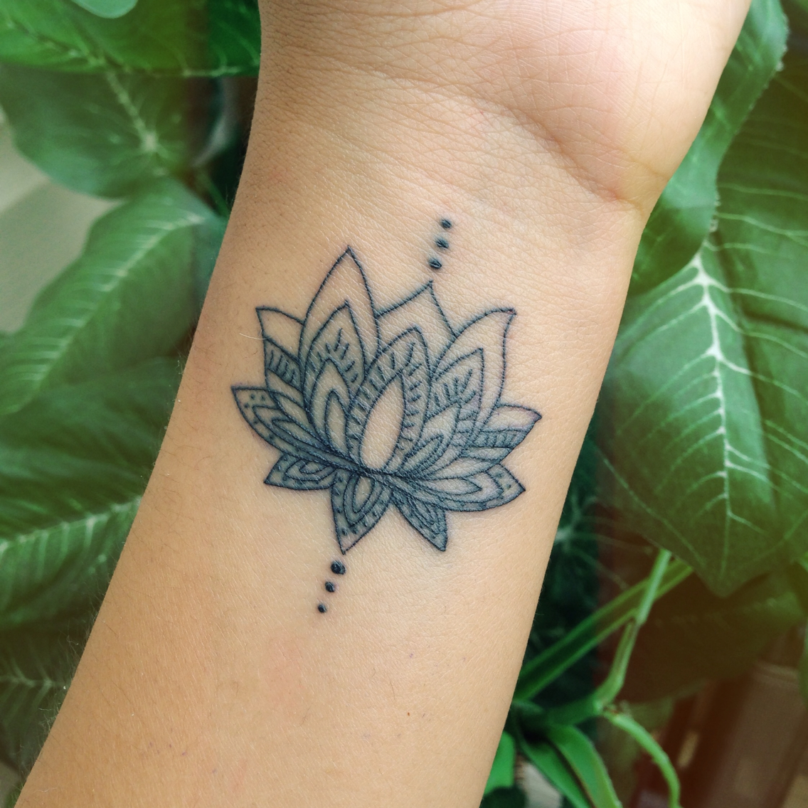 Incredible Traditional Lotus Tattoo On Wrist