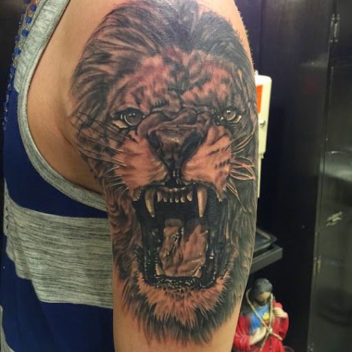 Incredible realistic Lion Tattoo On Bicep