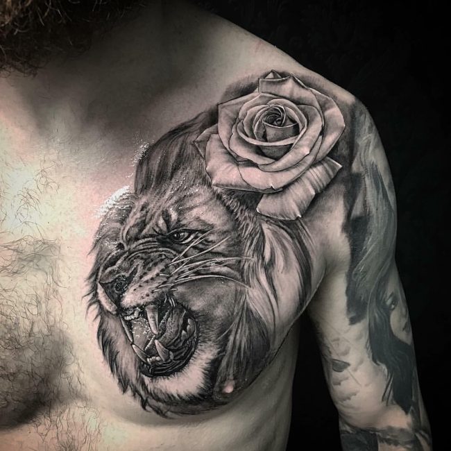 Lion And Rose Flower Tattoo On Chest And Sleeve