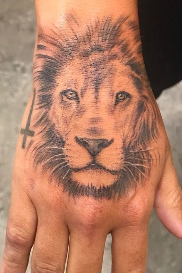 Lion Face And Cross Tattoo