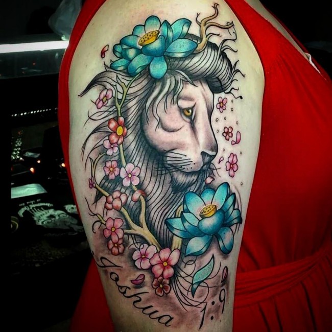 Lion With Colorful Flowers Tattoo On Bicep