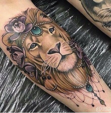 Lion With Pearls And Flowers Tattoo On Leg