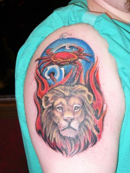 Lion face And Crab Tattoo On upper Sleeve